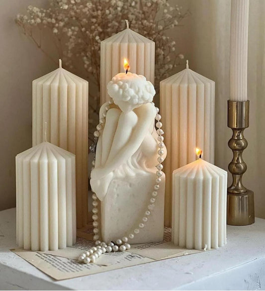 Dekoratif Lüks Mum Taş üstünde oturan kadın